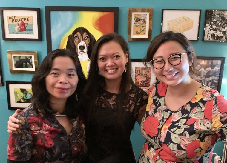 Award-winning Vietnamese authors Nguyen Pham Que Mai, left, and Ly Ky Tran, center, with Lucy Yu at the soft opening of Yu and Me.