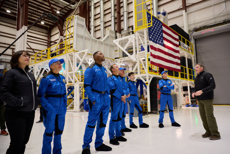 The crew of NS-19 visit New Shepard in the Barn