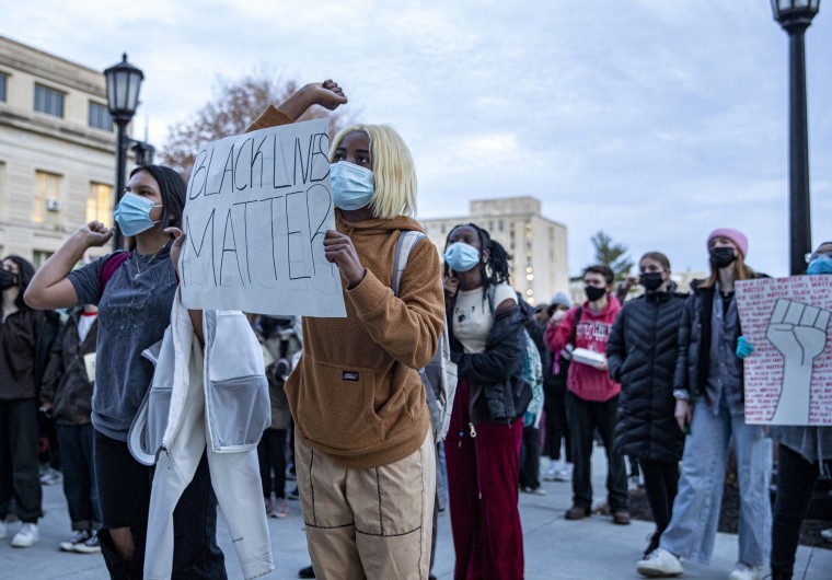 Image: Students show support at a protest against racial discrimination in Iowa public schools in Iowa City on Nov. 19, 2021.