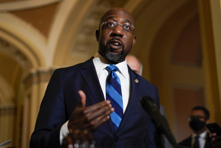 Sen. Raphael Warnock, D-Ga., speaks on Capitol Hill on Dec. 7, 2021.