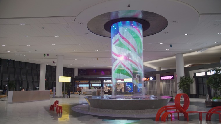 The 25-foot-tall water feature in Terminal B at New York’s LaGuardia Airport rotates in a holiday-themed show.