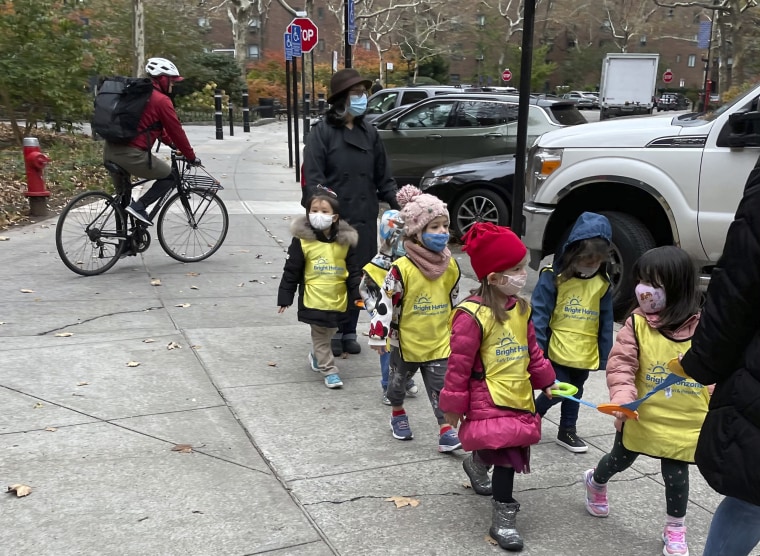 School children walk in line in New York on Nov. 22, 2021.