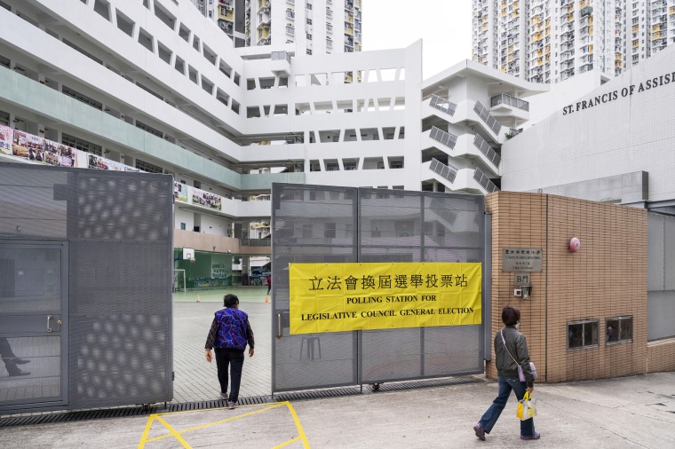 A woman enters a polling station in Hong Kong on Dec. 19, 2021.