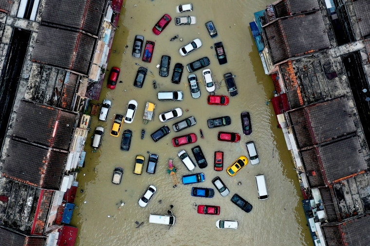 Image: Aerial view shows vehicles submerged in flood waters in Shah Alam