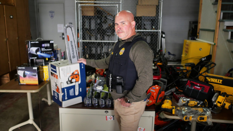Det. Sgt. Todd Curtis of the Perrysburg Township Police Department holds a stolen Husqvarna chainsaw that he bought from Richard Nye off of Facebook Marketplace in an undercover buy.