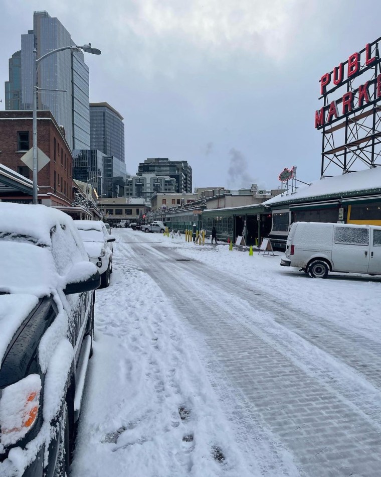 Snow coated Pike Place Market in a rare Seattle cold snap Sunday.