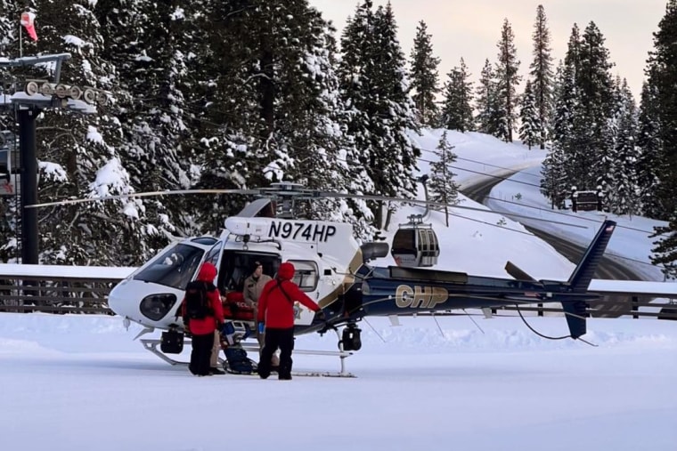 Image: Search personnel coordinate radar hits with a CHP helicopter crew member in the search for skier Rory Angelotta.