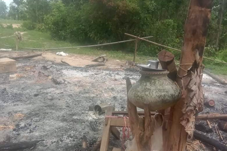 A burned structure with household goods is marked out near where bodies were found burned outside Taung Pauk village in the northwestern Sagaing region of Myanmar in July. 