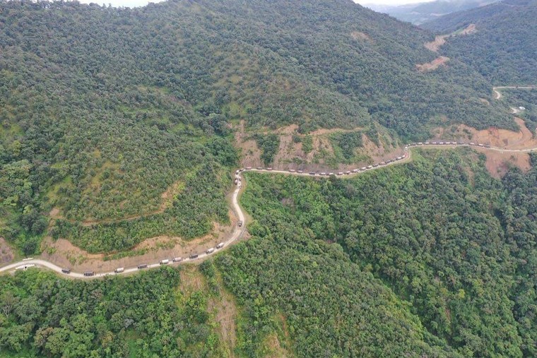 In this Oct. 14, 2021, aerial photo released by the Chin Human Rights Organization, a military convoy approaches Thantlang in Chin State in northwest Myanmar. 