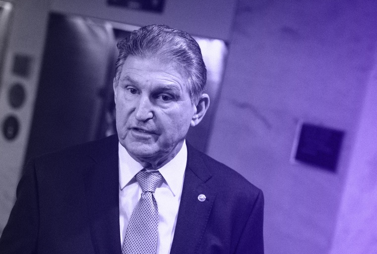 Senator Joe Manchin speaks to members of the media outside of his office on Capitol Hill in Washington, D.C. on Monday, Dec. 13.