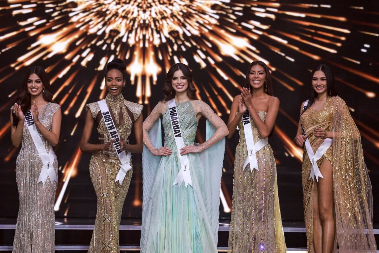 The top five Miss Universe contestants (L to R) Miss India, Harnaaz Sandhu; Miss South Africa, Lalela Mswane; Miss Paraguay, Nadia Ferreira; Miss Colombia, Valeria Ayos; and Miss Philippines, Beatrice Gomez pose on stage during the 70th Miss Universe beauty pageant in Israel's southern Red Sea coastal city of Eilat on December 13, 2021.