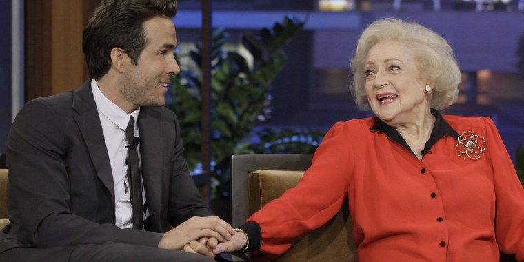 Ryan Reynolds holds Betty White's hand during a 2010 appearance on "The Tonight Show with Jay Leno."