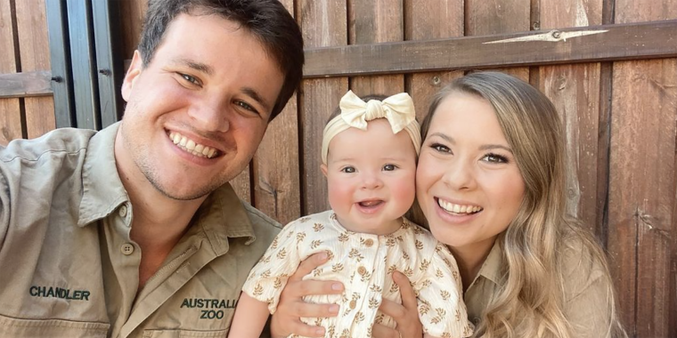 Bindi Irwin poses with husband Chandler Powell and their daughter, Grace Warrior.