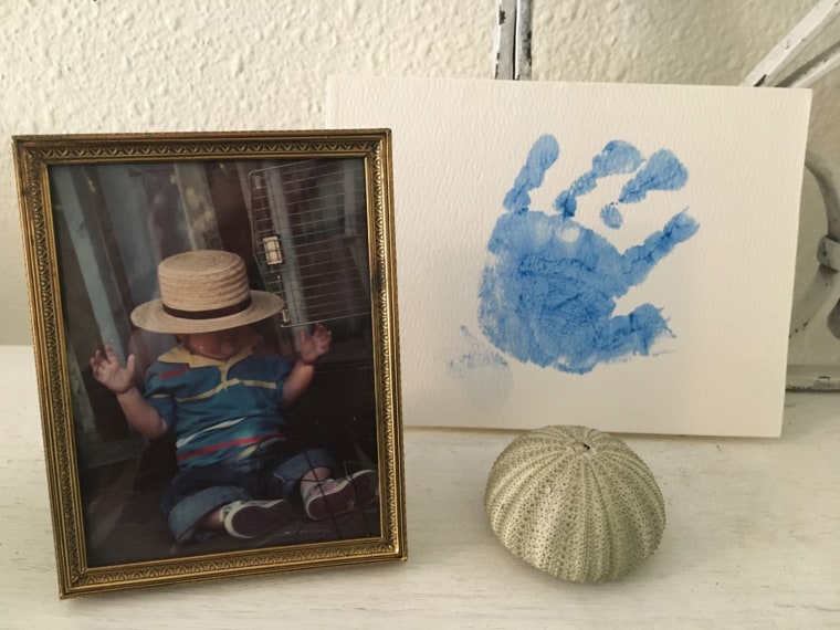 Carol Smith keeps her son Christopher's photo and handprint on a shelf in her home.