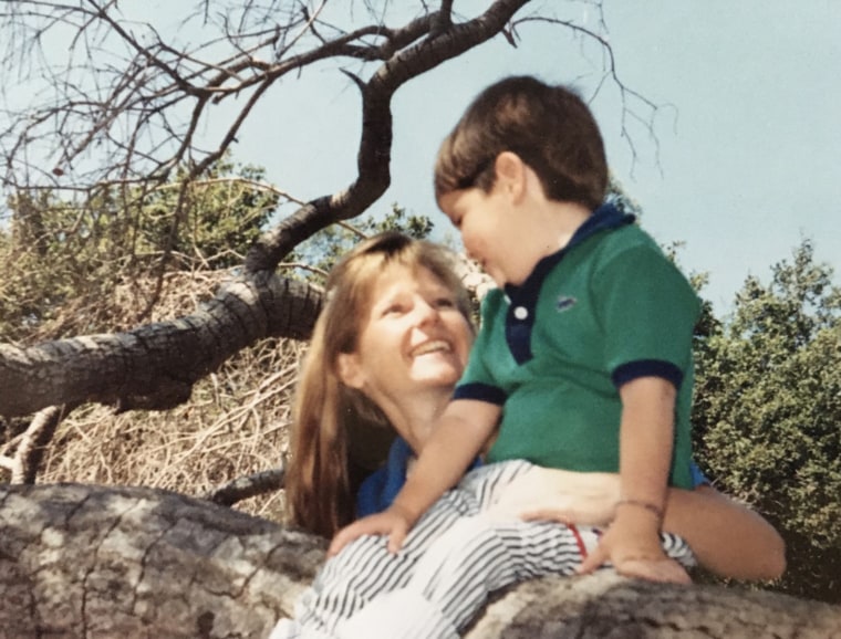 Carol Smith plays outside with Christopher on a sunny day.