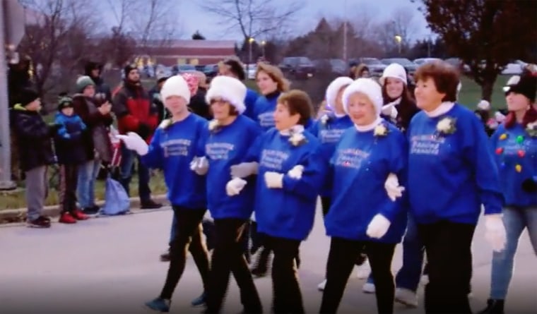 The Dancing Grannies walked arm in arm in a Christmas parade in Franklin, Wisconsin, on Monday in their first appearance since three members and a spouse of a member were killed on Nov. 21 when a truck plowed into a parade in Waukesha.