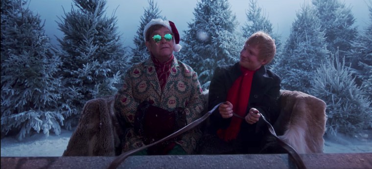 Elton John and Ed Sheeran go on a sleigh ride in their "Merry Christmas" music video.