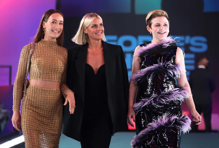 Maggie Q, Eliza Coupe, and Ginnifer Goodwin walk past fans at the 2021 People's Choice Awards.