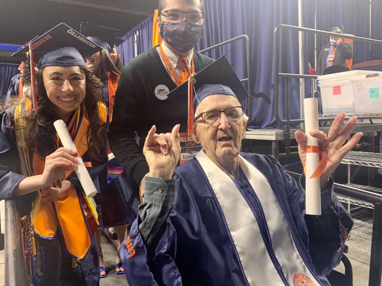 Neira, right, received his degree at 88 years old.