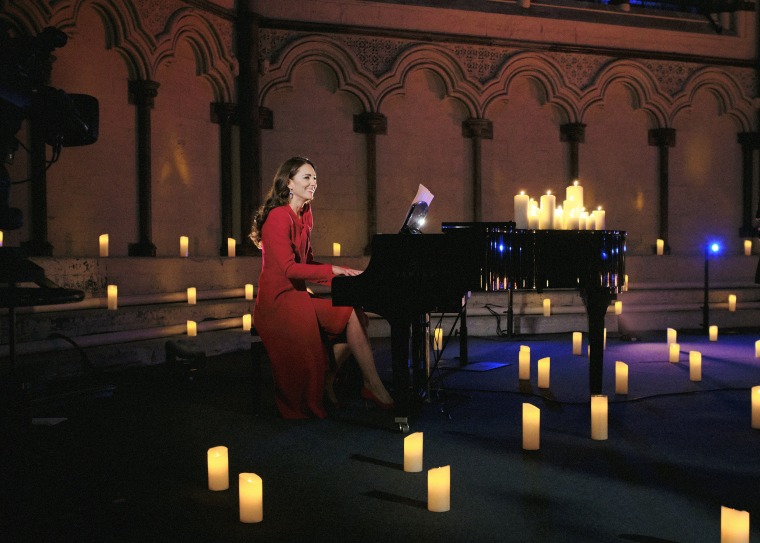 In this image released December 24, 2021, Catherine, Duchess of Cambridge accompanies singer Tom Walker on the piano during a performance of his song 'For Those Who Can't Be Here' during Royal Carols - Together At Christmas, a Christmas carol concert host