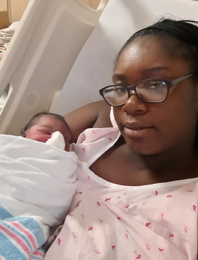 Kudaisi holding her brand new baby girl