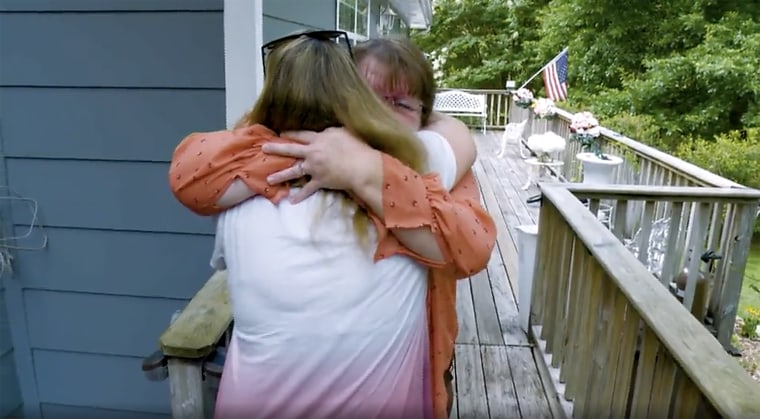 Nancy Womac (in orange) shared a hug with daughter Melanie Spencer this summer that was 42 years in the making.