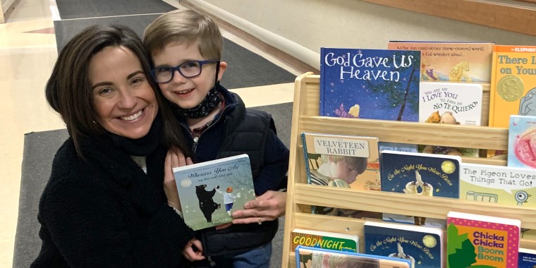 Nicole Collins is pictured with her surviving son, Asher. She read the book "Wherever You Are: My Love Will Find You" to Asher's twin brother, Will, after he was stillborn. She said she's since read the book so many times that she knows the words by heart.