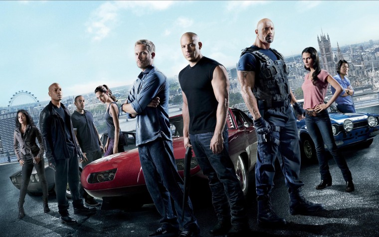 Dwayne "The Rock" Johnson (third from right) and Vin Diesel (fourth from right) are pictured with the rest of their "Fast Five" co-stars.