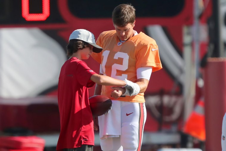 Brady's oldest son, Jack, with the Buccaneers star during training camp in Tampa last August.