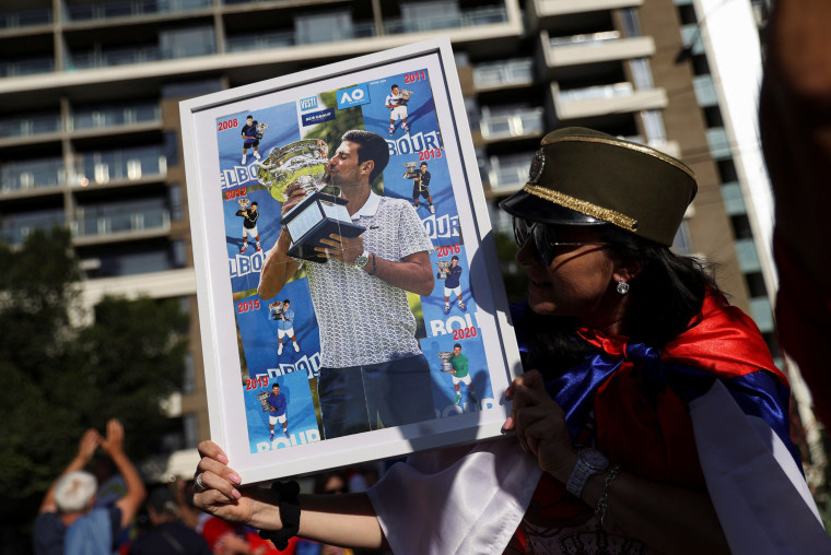 Image: Supporters gather outside the hotel where Novak Djokovic is believed to be held in Melbourne