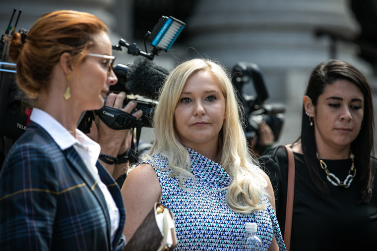 Virginia Giuffre, an alleged victim of Jeffrey Epstein, center, exits from federal court in New York on Aug. 27, 2019.