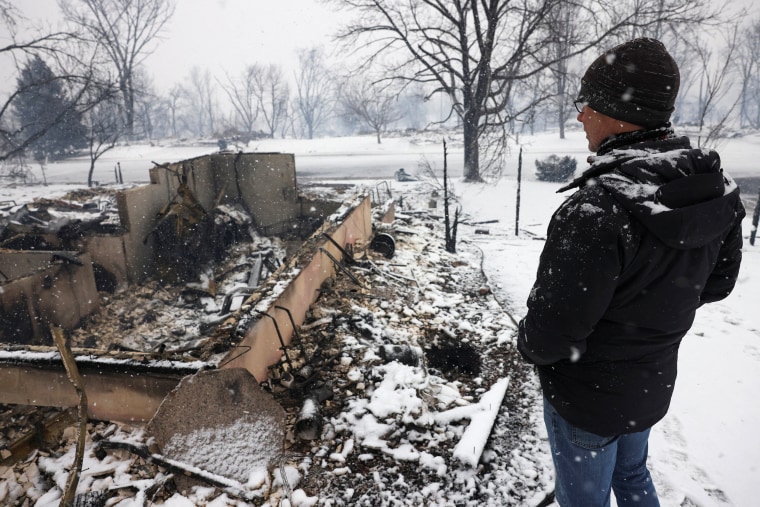 Image: Chris Dreier looks at his house burned by wildfires, in Colorado