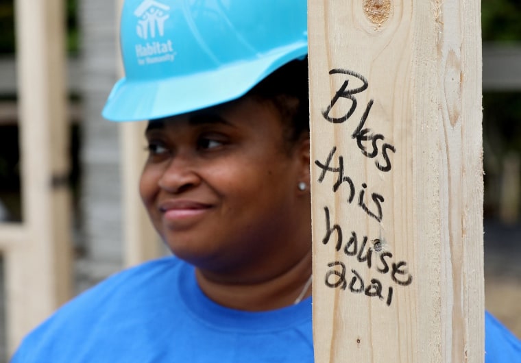 April volunteering during installation 3D-printed house walls at a Habitat for Humanity site.