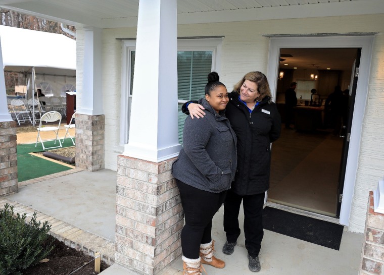 April volunteers during installation of 3D-printed house walls at a Habitat for Humanity site.