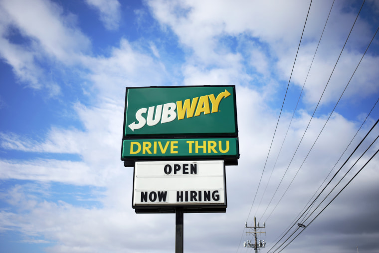 A 'Now Hiring' sign outside a Subway restaurant in Seymour, Ind., on Dec. 6, 2021.