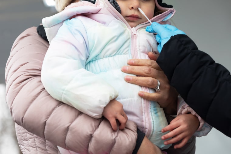A child receives a Covid-19 test at a Philadelphia Department of Public Health mobile testing site in Philadelphia on Dec. 30, 2021.