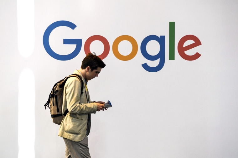A man walks past Google during the VivaTech trade fair on May 24, 2018 in Paris.