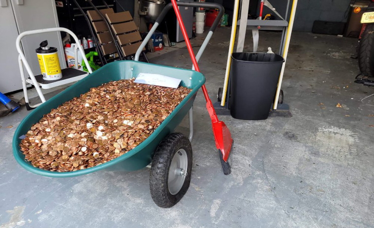 A wheelbarrow filled with pennies