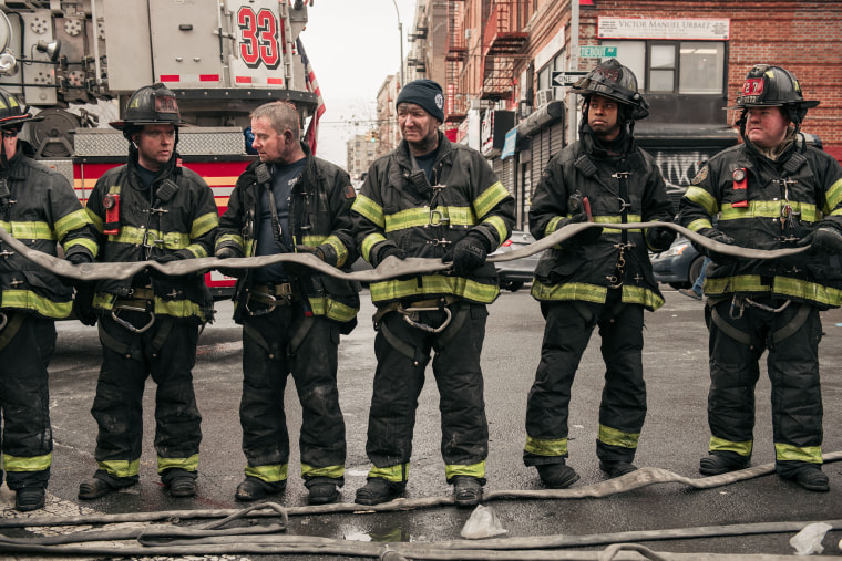 Image: Emergency first responders remain at the scene after an intense fire at a 19-story residential building that erupted in the morning on Jan. 9, 2022 in the Bronx, N.Y.