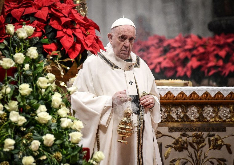 Image: Pope Francis arrives to celebrates the Epiphany Mass at St Peter's Basilica at the Vatican on Jan. 6, 2022.