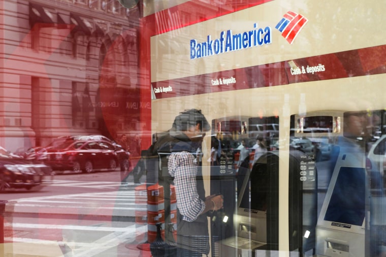Image: Customer uses an ATM at a Bank of America branch in Boston