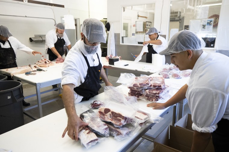 Image: Workers Process Meat At Butcher And Processing Plant As Pandemic Threatens Food Supply Chains