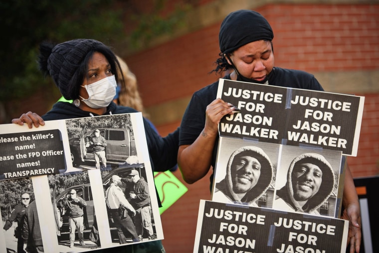 Demonstrators march to demand justice for Jason Walker on Jan. 9, 2022, in Fayetteville, N.C.