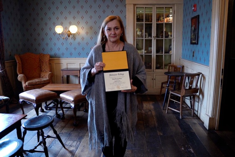 Image: Patricia Rizzo with her daughter's Skidmore College diploma.