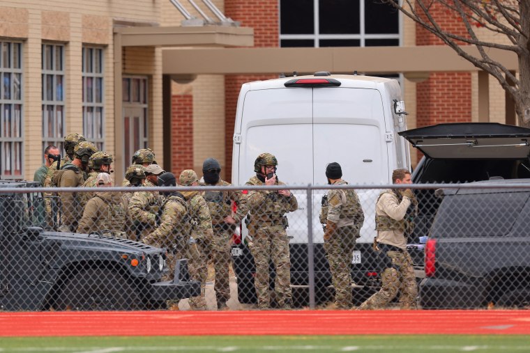 SWAT team members deploy near the Congregation Beth Israel Synagogue in Colleyville, Texas, on Jan. 15, 2022.