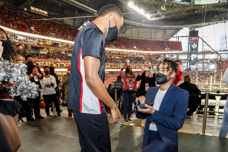 Dominic Williams proposes to Atlanta Falcons cheerleader Benjamin Ajani.