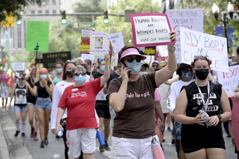 Protesters participate in a March for Abortion Access demonstration on Oct. 2, 2021, in Orlando, Fla. 