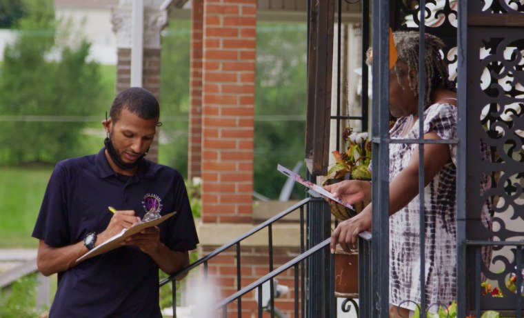 Farrakhan Shegog speaks with a homeowner in St. Louis in a scene from "Avenue of Dreams."