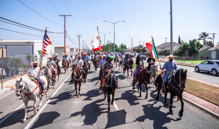 Approximately 200 vaqueros ride through the streets of Compton on Sept. 20, 2020.