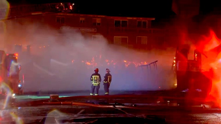 Firefighters battle a massive 9-alarm fire in Salisbury, MA, overnight. 